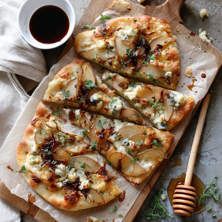 A pizza with onions and blue cheese on a wooden cutting board.