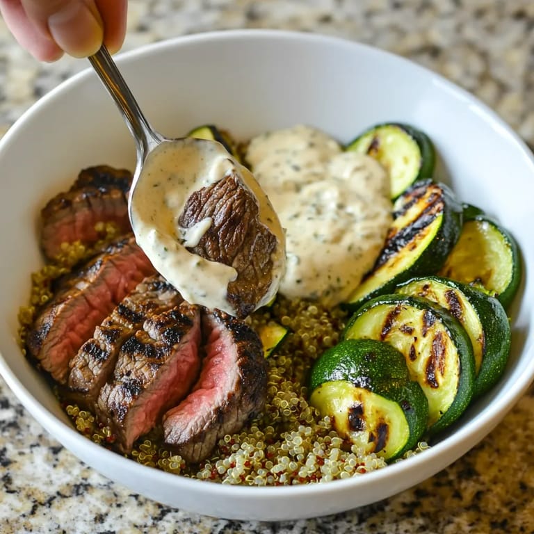 A bowl of food with a spoon in it.