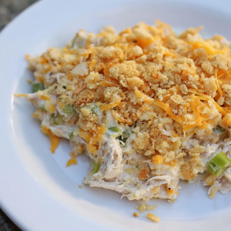 This Neiman Marcus-Style Chicken Casserole showcases a golden-brown cracker topping over a rich, savory chicken and cheese blend.
