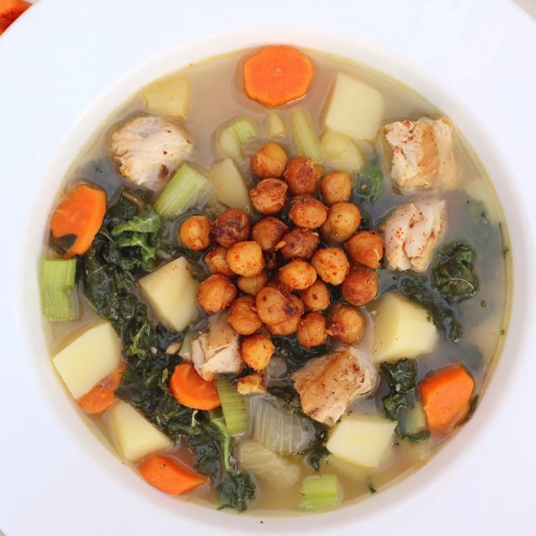 Golden, roasted chickpeas topping a bowl of Chicken Kale Soup, ready for a satisfying, healthy meal.