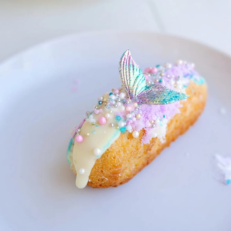 Close-up of freshly decorated Mignardises Queue de Sirène, ready to serve for a delightful dessert.