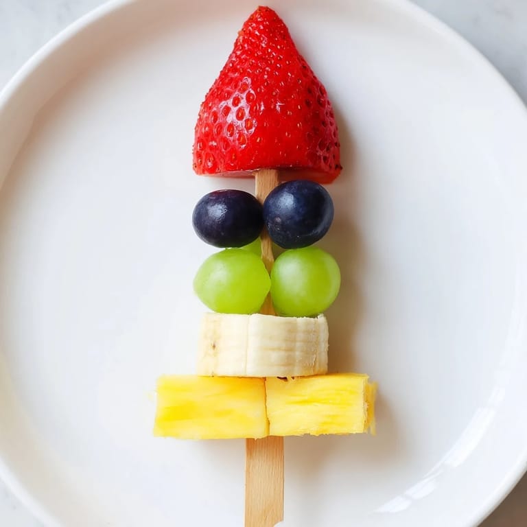 Colorful Rocket Ship Fruit Skewers offer a healthy and fun treat, layered with fresh, juicy fruit pieces.