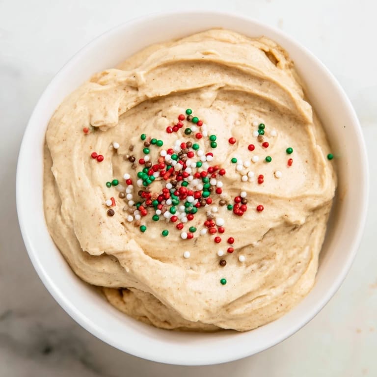 Indulge in a delightful Gingerbread House Dip Board; the sweet, spiced dip is perfect for holiday entertaining.