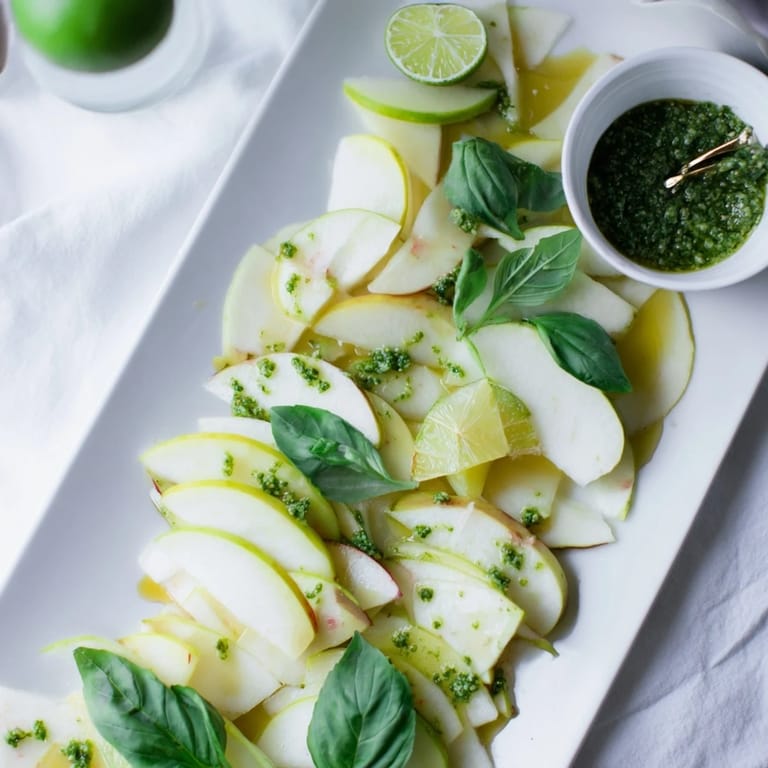 Beautiful array of the Emerald City: Fresh Granny Smith apples, pesto, and green olives awaiting to be enjoyed.