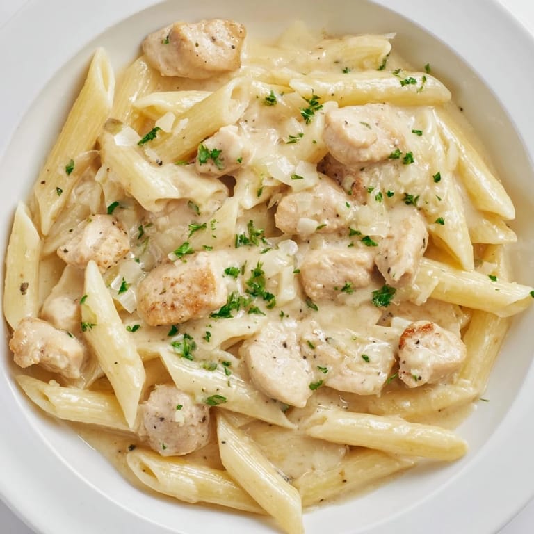 Enjoy this comforting bowl of Quick Garlic Parmesan Chicken Pasta–a flavorful, easy weeknight dinner idea!