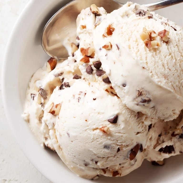 Cool, refreshing cottage cheese ice cream, swirled with fresh berries, looks delicious.