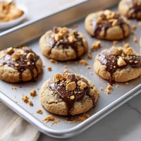 A pan of cookies with chocolate and peanut butter.