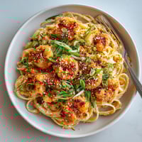 A plate of homemade bang bang shrimp pasta.