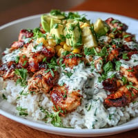 Street Corn Chicken Rice Bowls: vibrant, juicy chicken and creamy corn topping.
